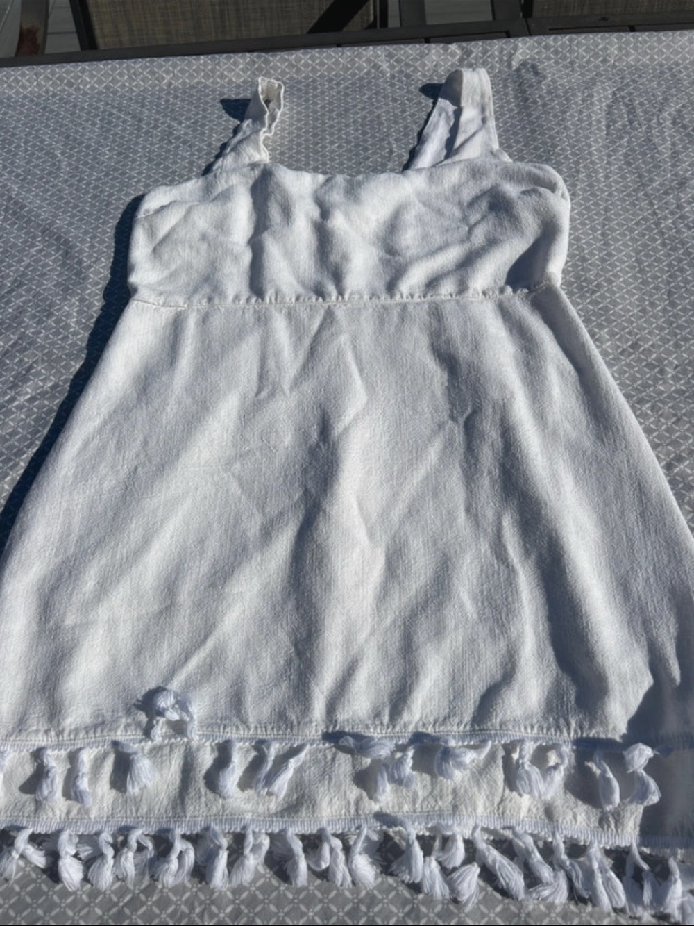 Lulu's White Mini Dress with Tassel Hem